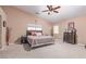Spacious main bedroom with high ceilings, carpet floors, and plentiful natural light at 6954 Jacksboro Ct, North Las Vegas, NV 89084