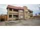 Two-story multi-Gathering building featuring a red tile roof and stucco exterior at 6996 Hopkins Dr, Las Vegas, NV 89156