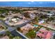 Vast aerial perspective of a home, highlighting its solar panels, refreshing pool, and verdant surroundings in a residential area at 7111 Bath Dr, Las Vegas, NV 89131