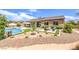 Expansive backyard with pool, spa, fire pit, and patio, perfect for outdoor gatherings at 7111 Bath Dr, Las Vegas, NV 89131