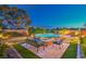Scenic backyard design with a fire pit, seating area, and a tranquil pool, perfect for relaxation at 7111 Bath Dr, Las Vegas, NV 89131