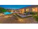Expansive backyard featuring a pool, outdoor seating, and lush landscaping for a serene retreat at 7111 Bath Dr, Las Vegas, NV 89131