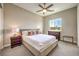 Bright bedroom with a cozy bed, neutral tones, and a view of the outside at 7111 Bath Dr, Las Vegas, NV 89131