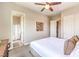 Bedroom featuring plush bed, ensuite bathroom, and access to ample closet space at 7111 Bath Dr, Las Vegas, NV 89131