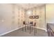 Cozy dining area with modern lighting, seating for four, and stylish decor at 7111 Bath Dr, Las Vegas, NV 89131