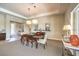 Cozy dining room with pendant lighting, neutral paint, and open entryway at 7111 Bath Dr, Las Vegas, NV 89131