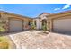 Elegant home featuring a brick driveway and a two-car garage at 7111 Bath Dr, Las Vegas, NV 89131