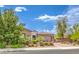Beautiful single-story home with meticulous landscaping and a welcoming brick driveway at 7111 Bath Dr, Las Vegas, NV 89131