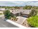Aerial view of a beautiful house featuring a large yard, mature landscaping and a paver driveway at 7111 Bath Dr, Las Vegas, NV 89131