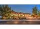 Well-maintained home exterior featuring manicured landscaping and a paved driveway at 7111 Bath Dr, Las Vegas, NV 89131
