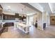 Modern kitchen boasts dark wood cabinetry, a mosaic backsplash, and stainless steel appliances at 7111 Bath Dr, Las Vegas, NV 89131