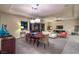 Open-concept living room featuring modern lighting, sleek furniture, and access to the outdoor patio area at 7111 Bath Dr, Las Vegas, NV 89131