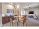 Modern living area with stylish chandelier, comfortable seating, and sleek media center at 7111 Bath Dr, Las Vegas, NV 89131