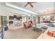 Bright, open living room featuring modern furnishings and seamless flow into the updated kitchen area at 7111 Bath Dr, Las Vegas, NV 89131