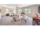 Oversized main bedroom featuring ample natural light, a seating area, and plush carpeting at 7111 Bath Dr, Las Vegas, NV 89131