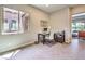 Home office featuring a window and desk creating a comfortable work environment with tile flooring at 7111 Bath Dr, Las Vegas, NV 89131