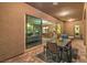 Covered patio with a dining table and view into the house, highlighting an open indoor-outdoor connection at 7111 Bath Dr, Las Vegas, NV 89131