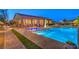 Outdoor living space with a pool, spa, patio, and manicured landscaping, ideal for entertaining or relaxation at 7111 Bath Dr, Las Vegas, NV 89131