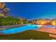 Sparkling swimming pool with a spa and beautifully landscaped surroundings, perfect for leisure and enjoyment at 7111 Bath Dr, Las Vegas, NV 89131