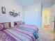 Twin bedroom with carpet, closet and direct access to hallway at 7225 Millerbird St, North Las Vegas, NV 89084