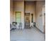Inviting front porch features neutral tones, decorative door, and attractive landscaping at 7225 Millerbird St, North Las Vegas, NV 89084