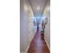 Hallway with wood floors leading to other areas of the home at 7225 Millerbird St, North Las Vegas, NV 89084