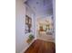 Hallway with wood floors leading to other areas of the home at 7225 Millerbird St, North Las Vegas, NV 89084