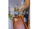 Contemporary kitchen featuring stainless steel appliances, granite counters and wood cabinets at 7225 Millerbird St, North Las Vegas, NV 89084