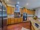 Traditional kitchen with stainless steel appliances and tan wood cabinets at 7225 Millerbird St, North Las Vegas, NV 89084