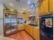 Modern kitchen with stainless steel appliances, granite countertops, and traditional cabinets at 7225 Millerbird St, North Las Vegas, NV 89084