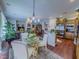 Open concept kitchen with stainless steel appliances, and view to dining and living rooms at 7225 Millerbird St, North Las Vegas, NV 89084