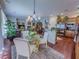 Open concept kitchen with stainless steel refrigerator, view to dining and living rooms at 7225 Millerbird St, North Las Vegas, NV 89084
