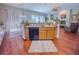 Gourmet kitchen features granite countertops, modern appliances, and island, great for Gathering gatherings at 7225 Millerbird St, North Las Vegas, NV 89084