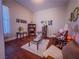 Relaxing living room featuring cozy armchairs, a central coffee table, and elegant decor at 7225 Millerbird St, North Las Vegas, NV 89084