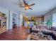 Open living area with wood floors flows into kitchen and dining area, great for entertaining at 7225 Millerbird St, North Las Vegas, NV 89084