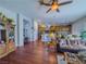 Open living area with wood floors flows into kitchen and dining area, great for entertaining at 7225 Millerbird St, North Las Vegas, NV 89084