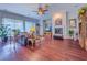 Spacious living room with wood floors, high ceilings, a fireplace, and lots of seating at 7225 Millerbird St, North Las Vegas, NV 89084