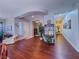 Inviting living area features hardwood floors, arched doorways, and an abundance of natural light at 7225 Millerbird St, North Las Vegas, NV 89084