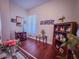 Well-decorated living room with wood floors, tasteful furniture, and decorative accents at 7225 Millerbird St, North Las Vegas, NV 89084