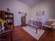 Bright living room with wooden accents, decorative shelving, and comfortable seating arrangement at 7225 Millerbird St, North Las Vegas, NV 89084