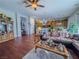 Open living area with wood floors flows into kitchen and dining area, great for entertaining at 7225 Millerbird St, North Las Vegas, NV 89084