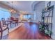 View of open floor plan featuring dining and living areas with hardwood floors at 7225 Millerbird St, North Las Vegas, NV 89084