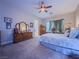 Serene bedroom featuring comfortable carpet, natural light, and ample dresser space at 7225 Millerbird St, North Las Vegas, NV 89084