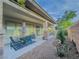 Covered patio featuring a dining set and decorative landscaping at 7225 Millerbird St, North Las Vegas, NV 89084