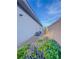 Side yard with low maintenance desert landscaping and modern air conditioning units at 7225 Millerbird St, North Las Vegas, NV 89084
