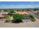 Aerial view of a charming home featuring a spacious yard, mature trees, and convenient street access at 7761 Cowboy Trl, Las Vegas, NV 89131