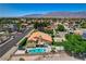 A beautiful home with a pool and mountains in the background at 7761 Cowboy Trl, Las Vegas, NV 89131