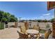 Cozy balcony space with comfortable outdoor seating and a stone-accented railing at 7761 Cowboy Trl, Las Vegas, NV 89131