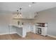 Basement bar area features custom cabinetry, shelving, and wine refrigerator at 7761 Cowboy Trl, Las Vegas, NV 89131