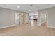 Spacious basement area showcasing hardwood floors and an open layout with multiple doorways at 7761 Cowboy Trl, Las Vegas, NV 89131
